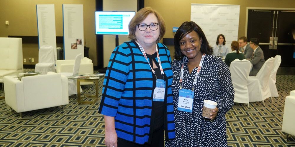 Foundation President Eva M. Wojcik, MD, FCAP, and Executive Director Maya Ogden pose together at the CAP's 2022 annual meeting.